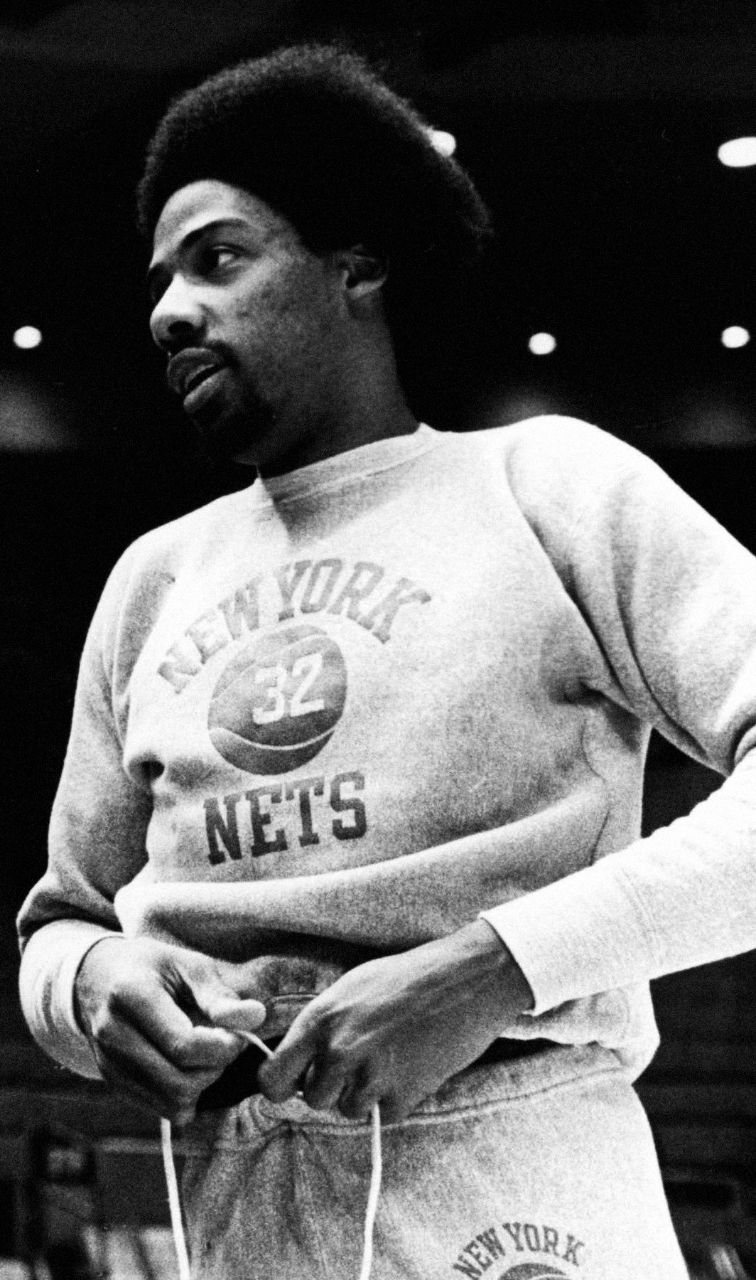 Julius Erving, Dr. J, in a New York Nets sweatshirt, 1975